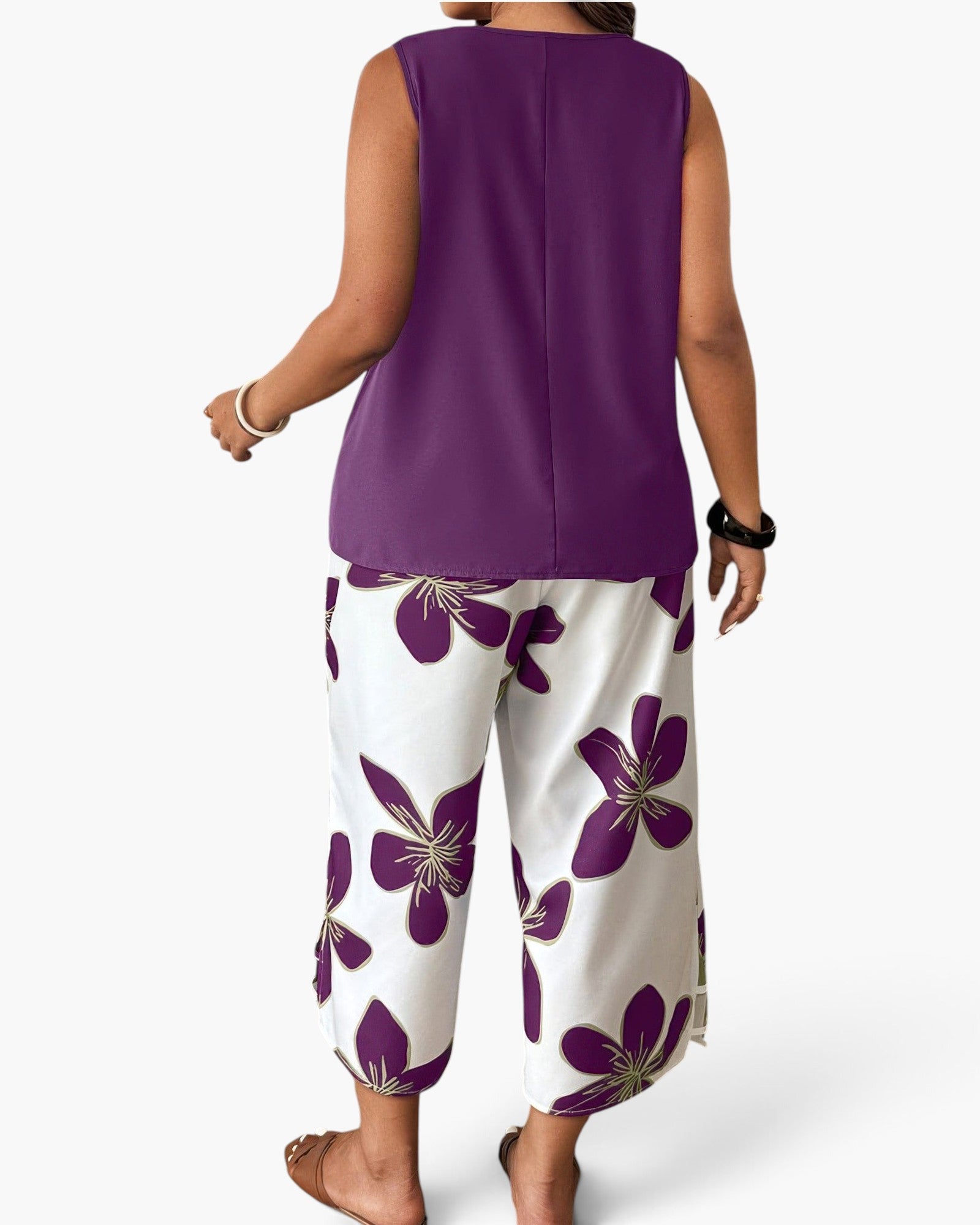 Beach Rose Co. plus size two-piece set featuring a purple sleeveless top and white pants with purple floral print.