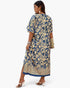 Beach Rose Co. plus size blue and beige geometric print V-neck dress with side split worn by a model with heels.
