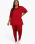 Beach Rose Co. plus size model wearing a red oversized t-shirt and matching leggings set for a comfortable look.