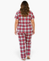 Back view of a woman wearing a Beach Rose Co. plus size red plaid pajama set with short sleeves and long pants.