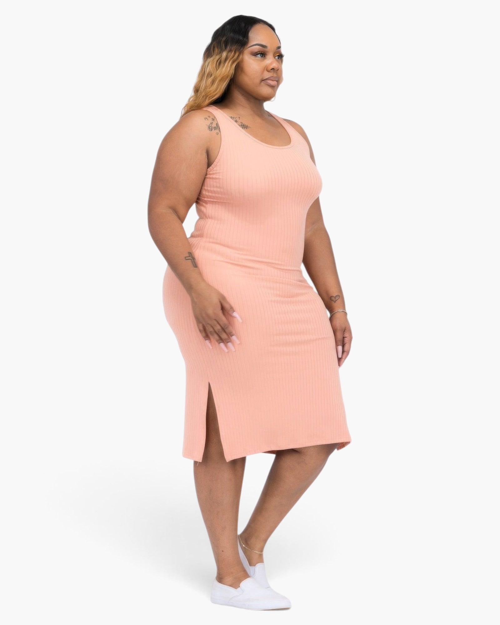 Beach Rose Co. plus size peach ribbed tank midi dress with side slits worn by a model with white sneakers