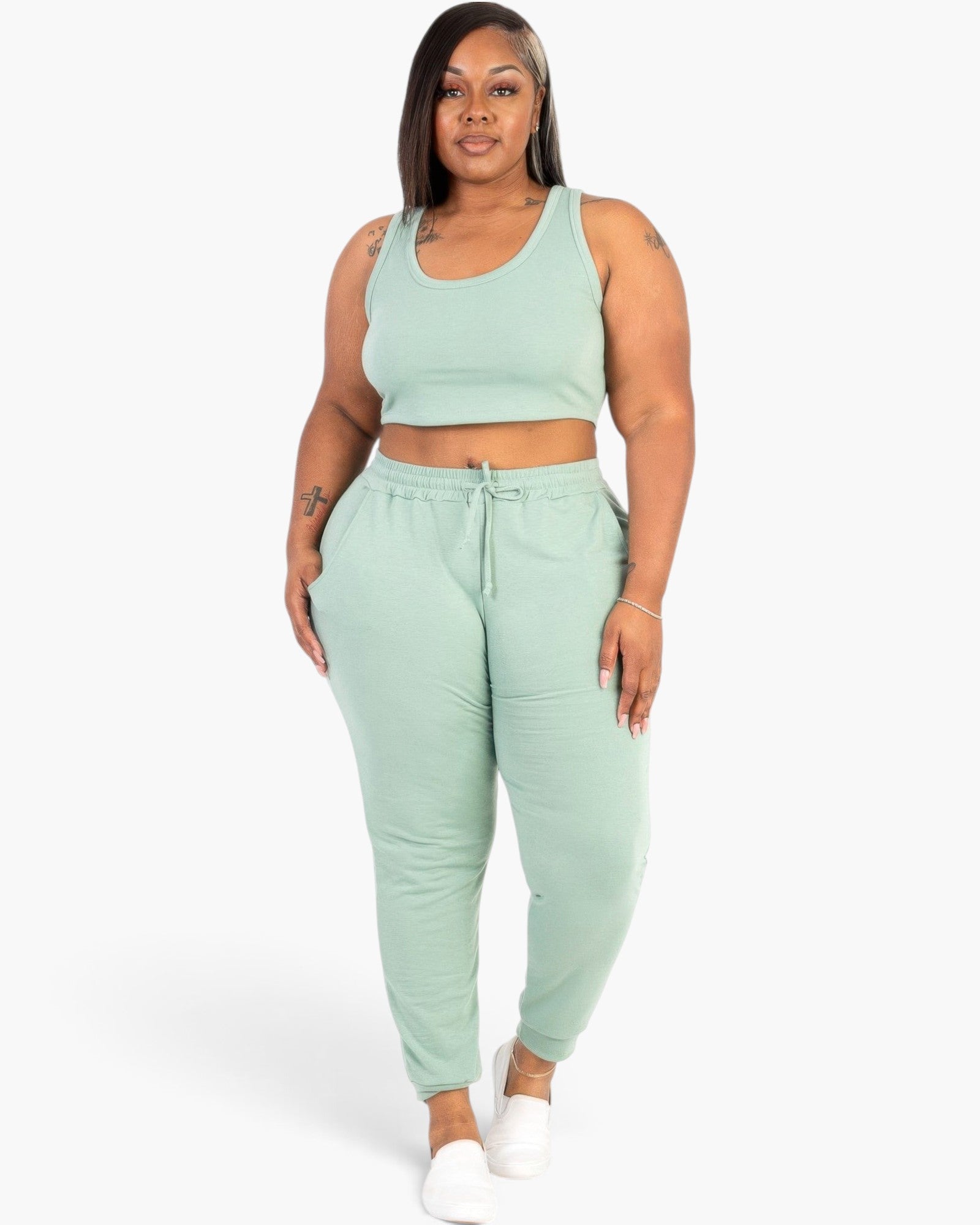 Beach Rose Co. plus size sage green French terry cropped tank top and drawstring jogger lounge set on a model