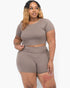 Beach Rose Co. plus size taupe short sleeve crop top and shorts set worn by a model against a white background.