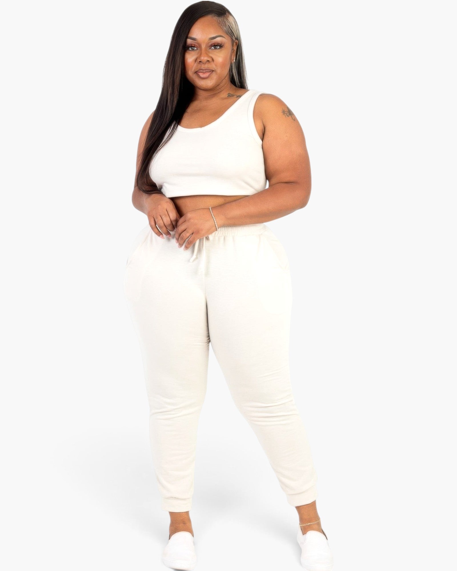 Beach Rose Co. plus size white French terry cropped tank top and jogger set worn by a model against a white background