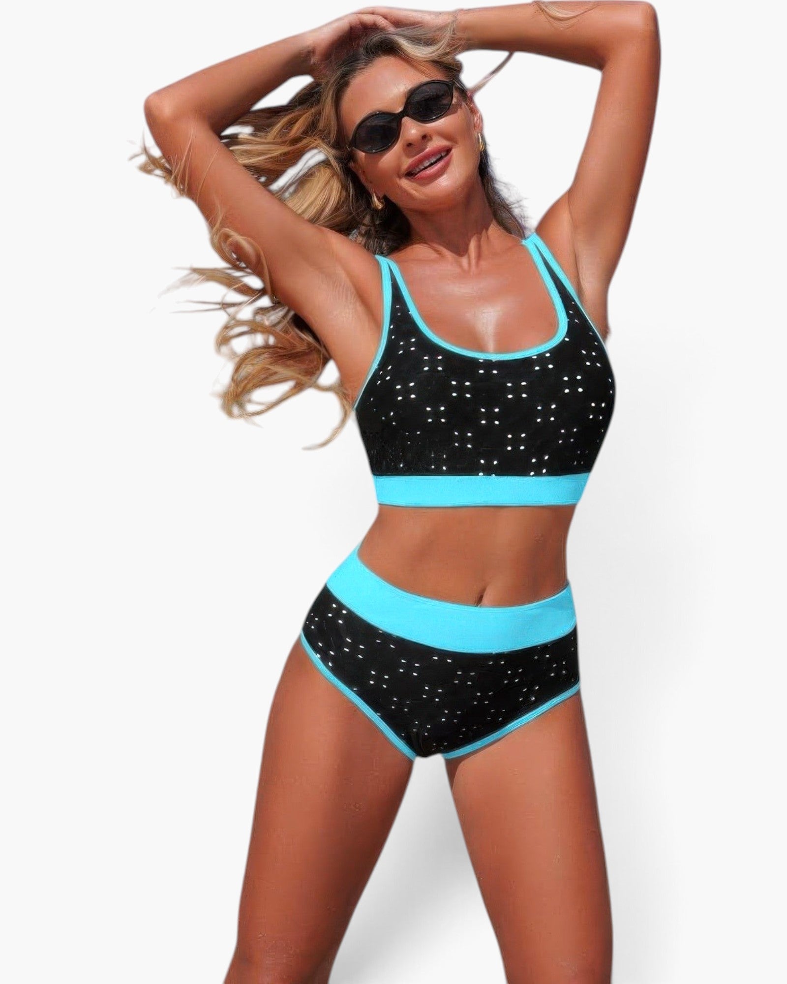 Beach Rose Co. black polka-dot high-waisted bikini set with bright blue contrast trim and scoop-neck top on a model.