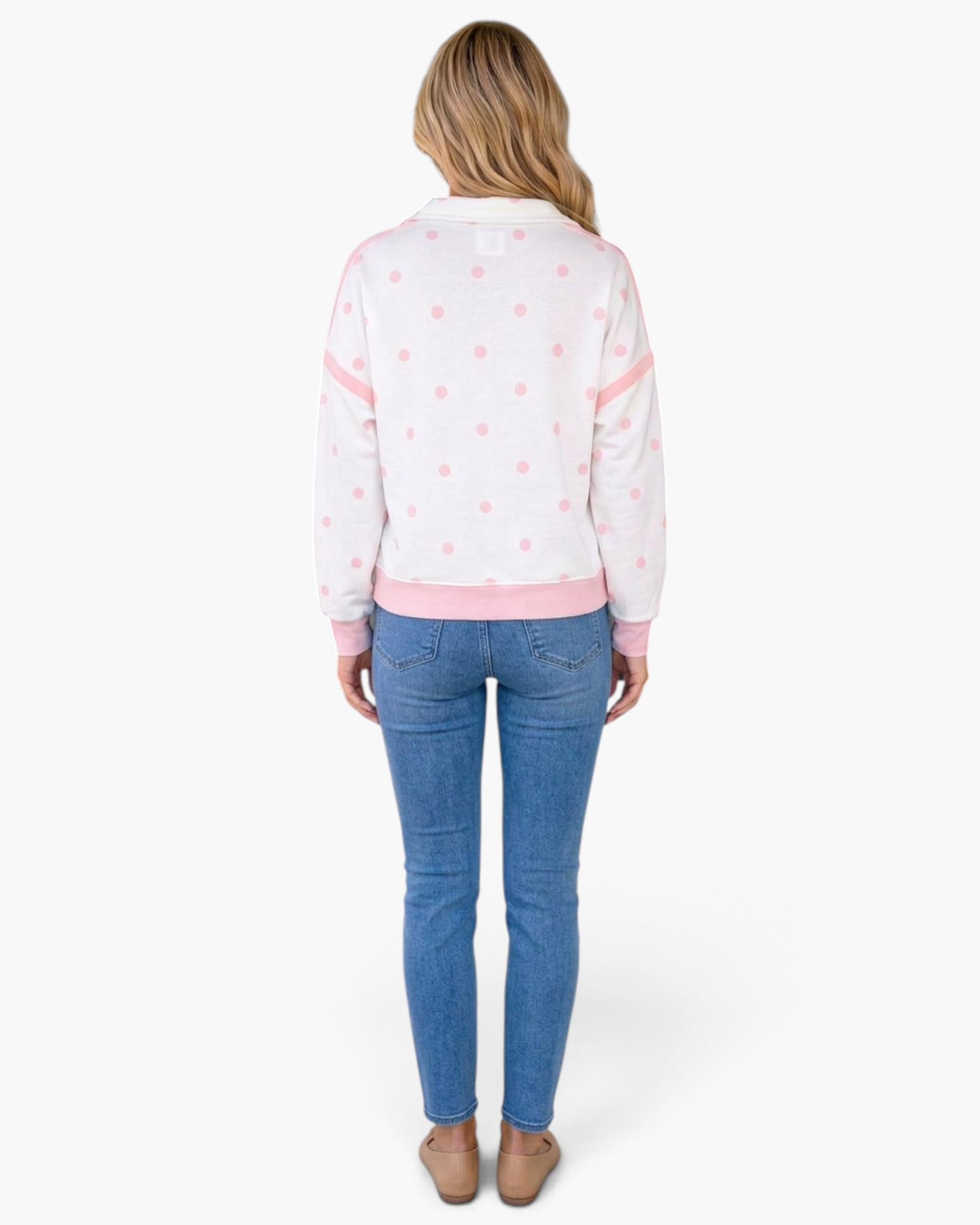 Beach Rose Co. white sweatshirt with pink polka dots, half-zip collar, and pink trim, worn by a blonde model.