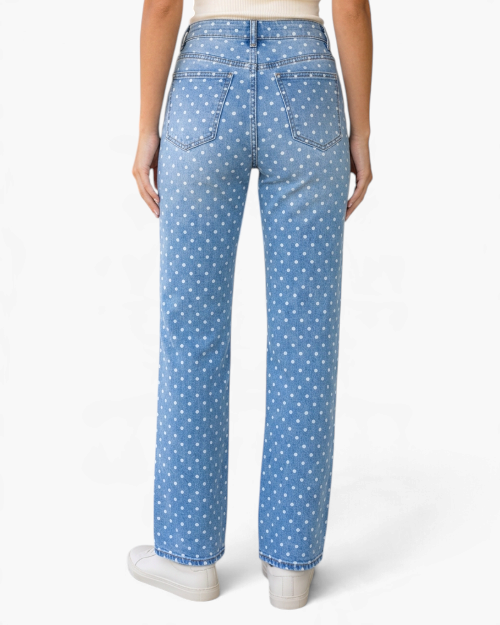 Beach Rose Co. light wash denim jeans featuring a white polka dot print and a wide leg fit, back view.