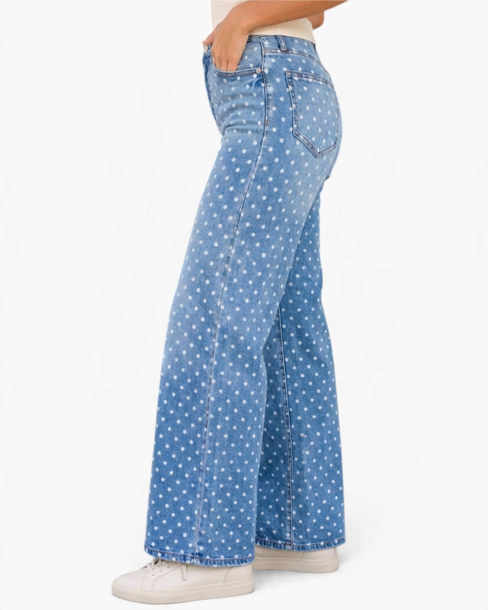 Beach Rose Co. light wash wide leg jeans with white polka dot print, five-pocket design, and stretch denim fabric.