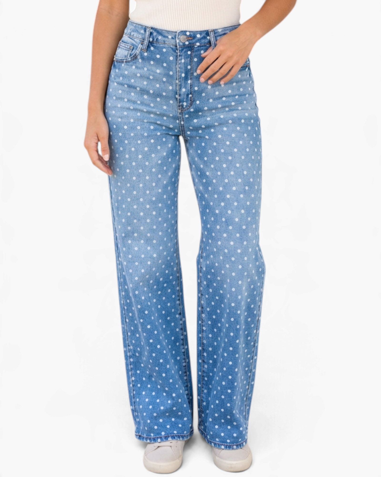 Beach Rose Co. light wash denim jeans with a white polka dot print and a wide leg silhouette on a model.