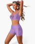 Beach Rose Co. purple two-piece bikini with crisscross front detail and tummy control shorts on a model