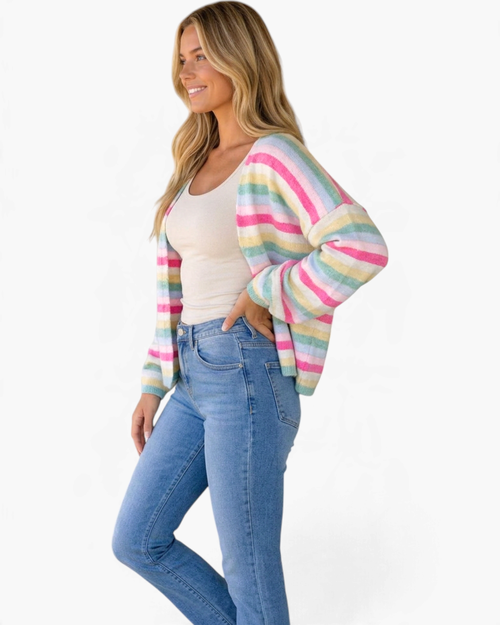 Beach Rose Co. model wearing a pink and pastel rainbow striped open-front knit cardigan with dropped shoulders.