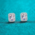 Beach Rose Co. rectangular moissanite stud earrings with zircon halos set in rhodium-plated sterling silver.