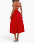Beach Rose Co. red sleeveless A-line dress with a ruched bust and open back, worn by a model from the back view.