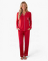 Beach Rose Co. red pajama set with button-front top, contrasting piping, and bow detail on the chest pocket.