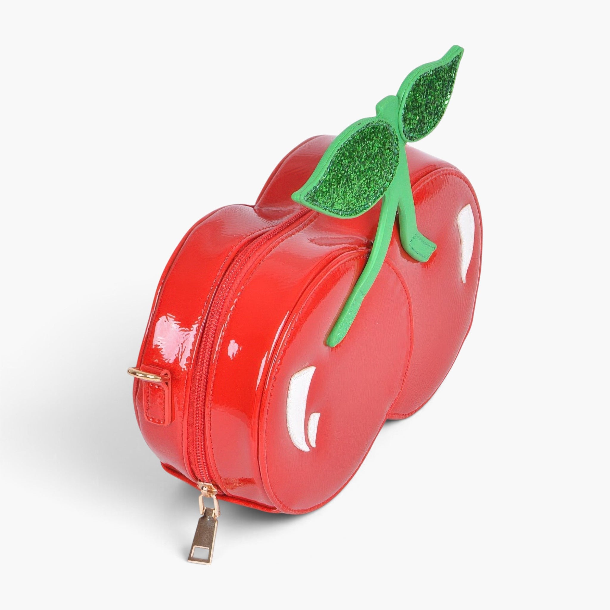Beach Rose Co. Yummy Cherry Clutch in glossy red polyurethane with green glitter leaf accents and gold metal hardware.