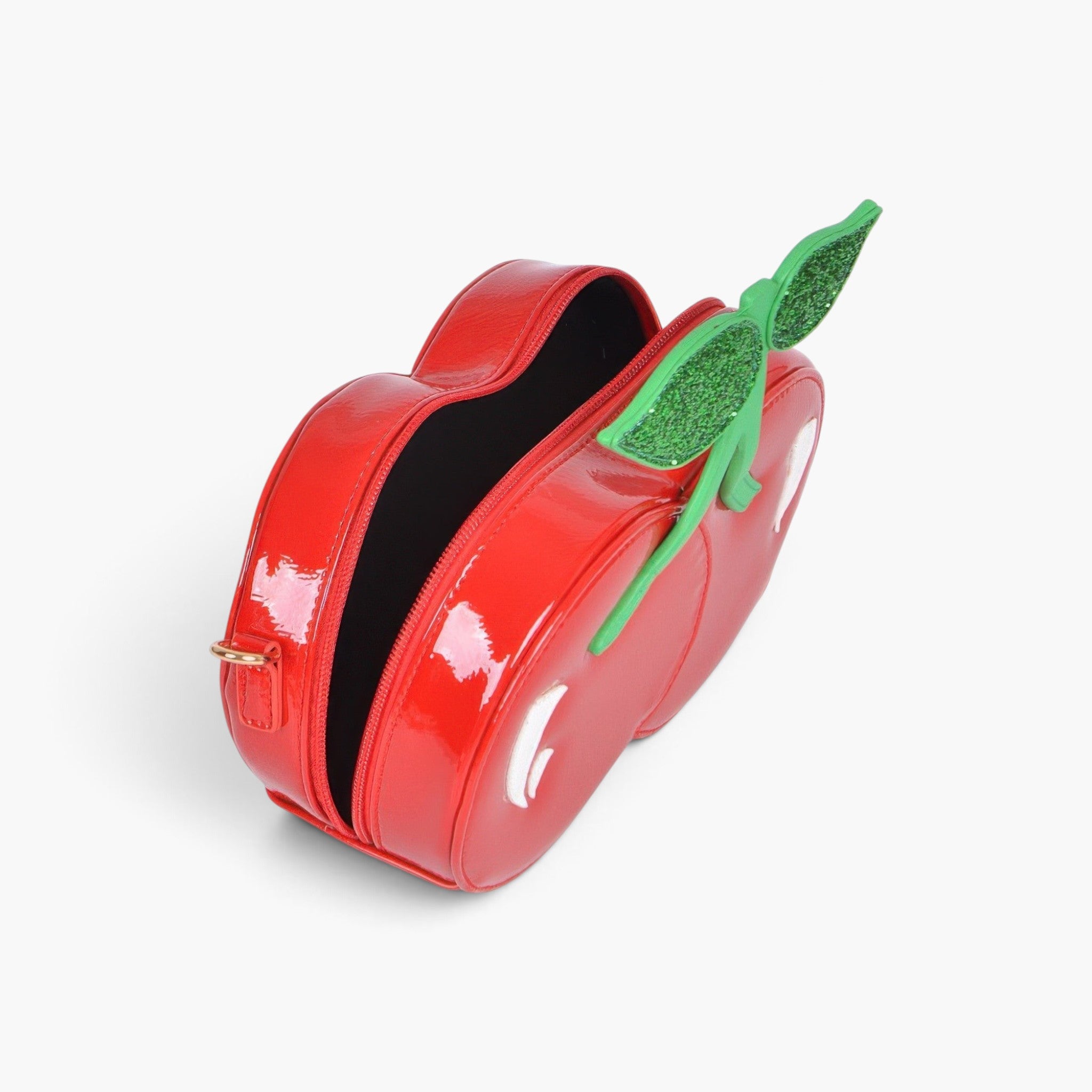 Beach Rose Co. red cherry-shaped clutch bag in glossy polyurethane with green glitter leaf accents.