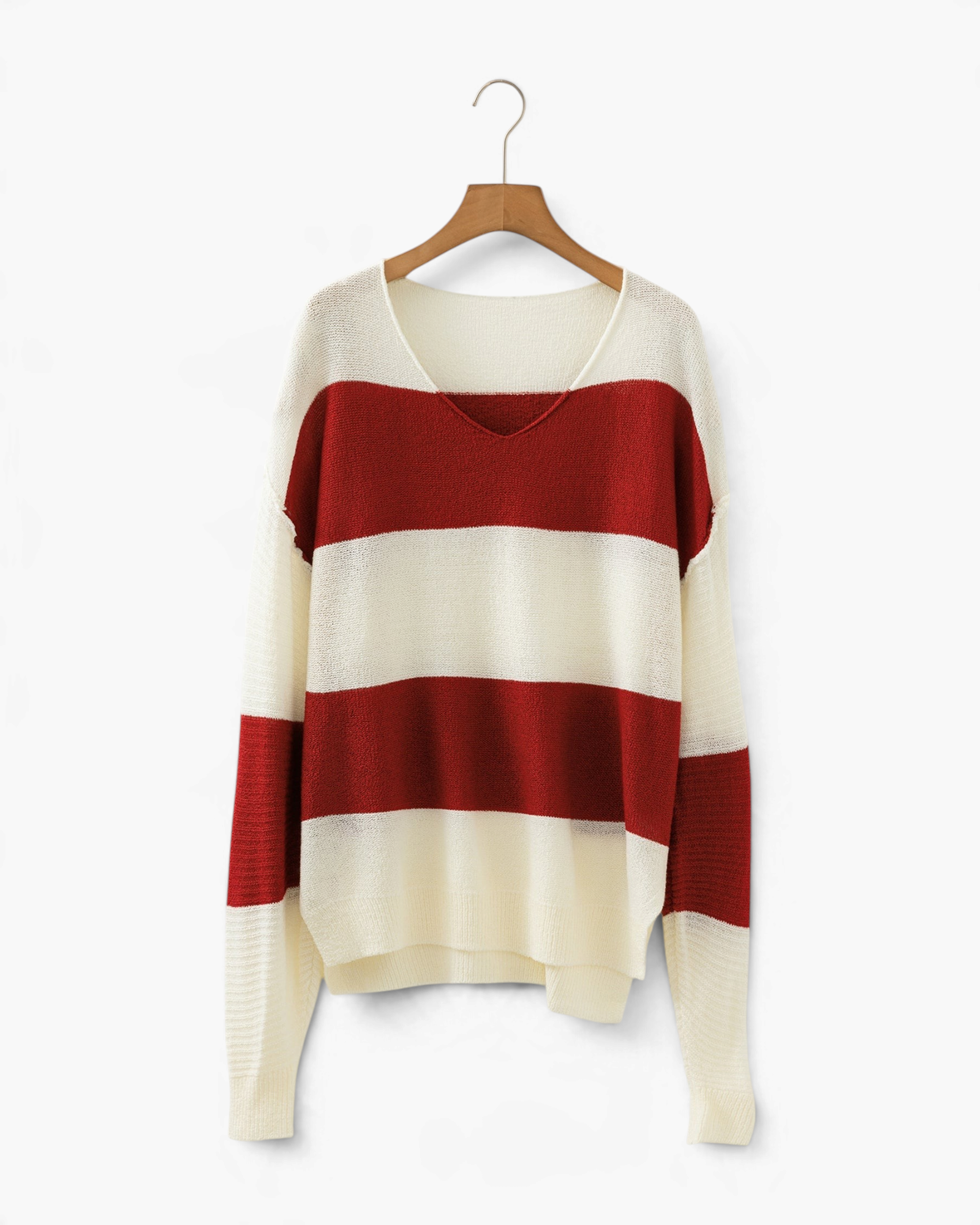 Beach Rose Co. red and cream wide stripe V-neck sweater with dropped shoulders and textured knit sleeves on a hanger.