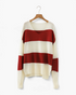 Beach Rose Co. red and cream wide stripe V-neck sweater with dropped shoulders and textured knit sleeves on a hanger.