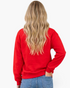 Beach Rose Co. red crewneck sweatshirt worn by a woman with long blonde hair, back view showing relaxed fit