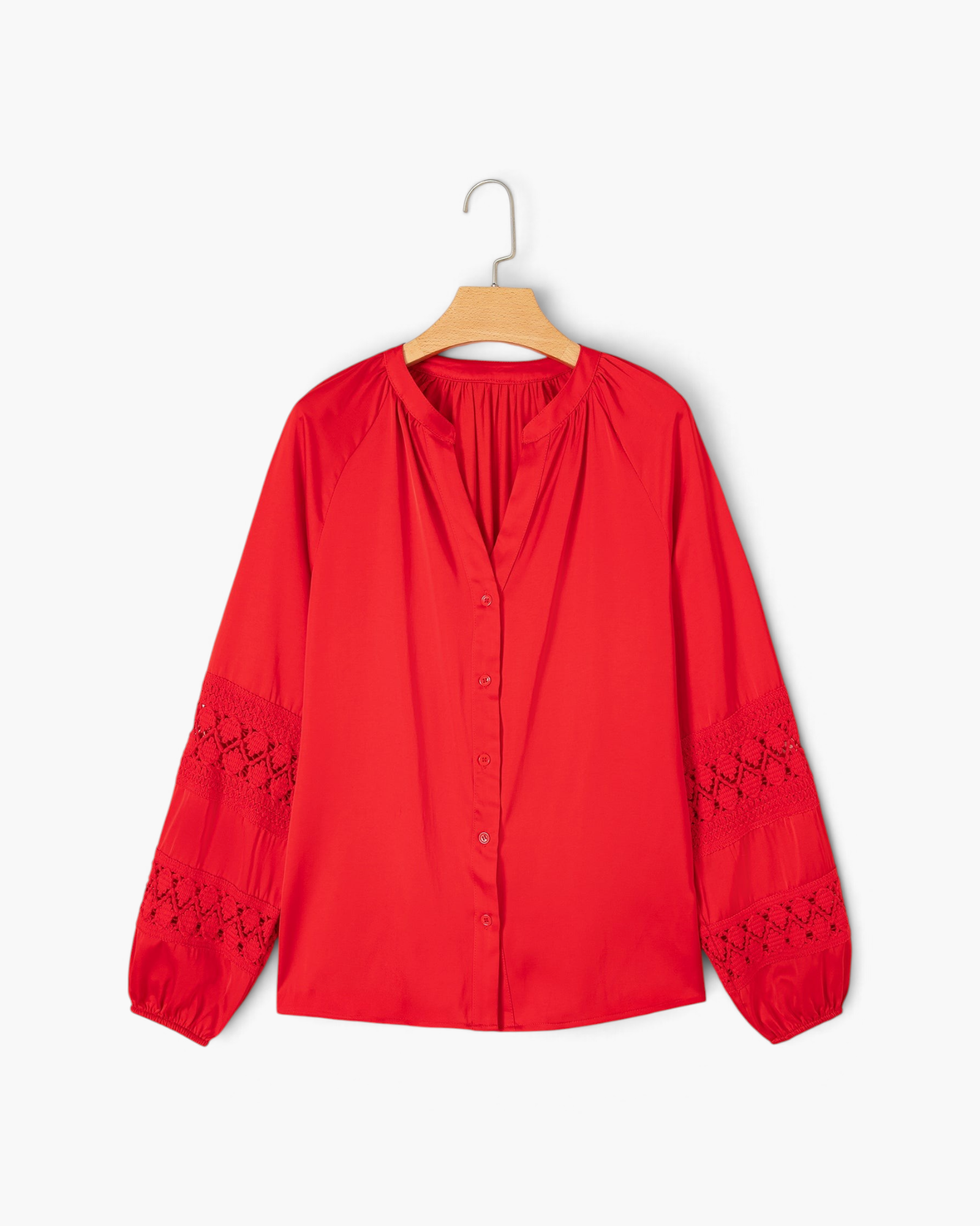 Beach Rose Co. red button-front blouse featuring long billowy sleeves with intricate crochet openwork panels.
