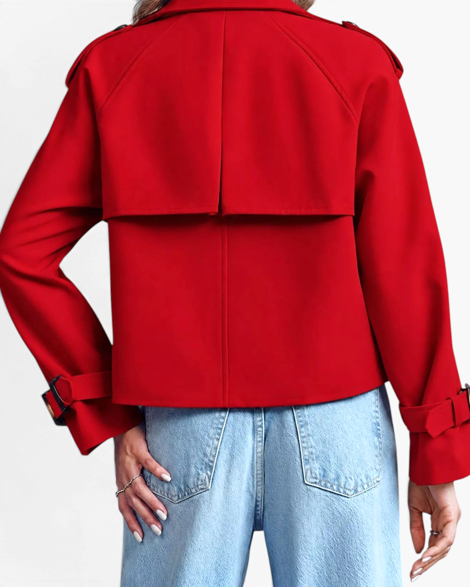 Beach Rose Co. red cropped trench jacket with back storm flap and buckled cuffs worn with light wash jeans