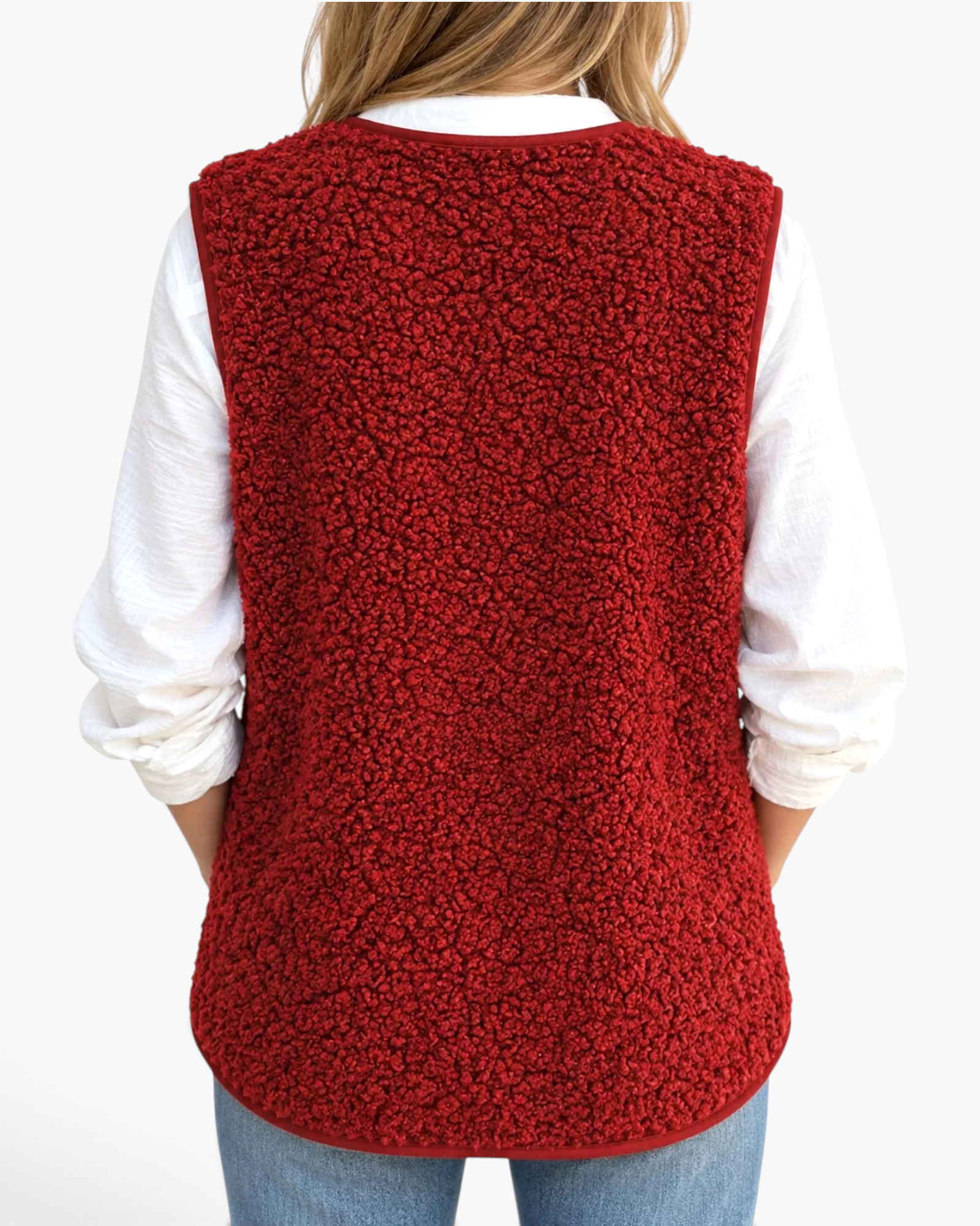 Beach Rose Co. red polar fleece vest worn over a white long-sleeve shirt, back view showing textured fabric.