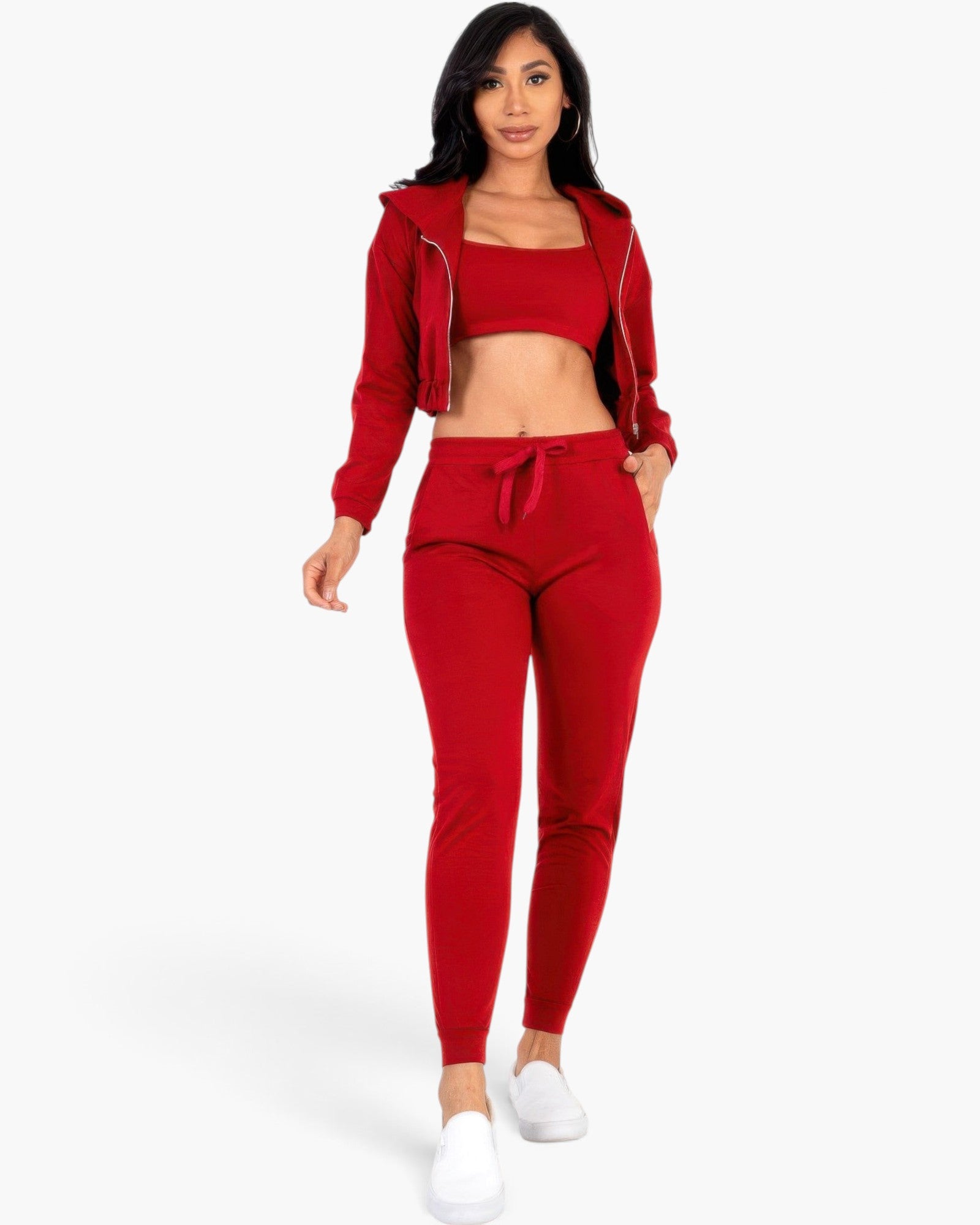 Beach Rose Co. red French terry three-piece set with a cropped cami, zip-up hoodie, and tapered joggers on a model.
