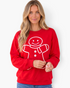 Beach Rose Co. red holiday sweatshirt featuring a smiling gingerbread man with textured cream trim and button details.