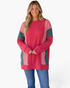 Beach Rose Co. model wearing a red ribbed tunic with green panels and red-white gingham patchwork, long sleeves.