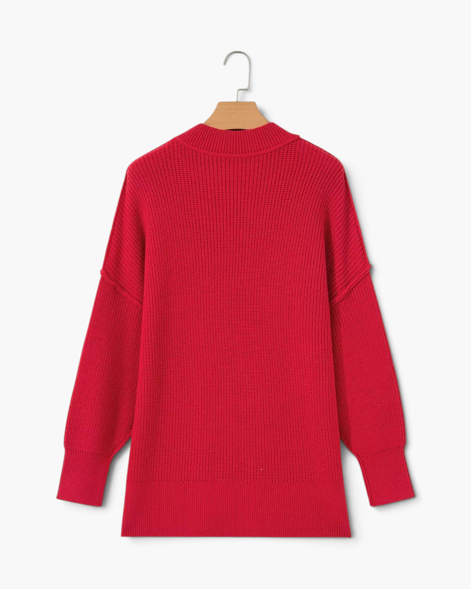 Beach Rose Co. red relaxed knit sweater with dropped shoulders, exposed seams, and ribbed cuffs viewed from the back.