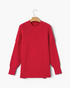 Beach Rose Co. red relaxed knit sweater with dropped shoulders, exposed seams, and wide ribbed cuffs on a hanger.