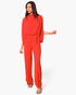 Beach Rose Co. red mock neck caftan jumpsuit with a flowing silhouette and textured fabric worn by a model