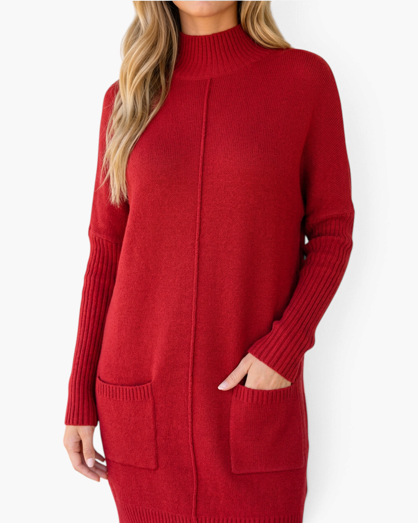 Beach Rose Co. red sweater dress with a ribbed mock neck, long sleeves, and front patch pockets on a blonde model.