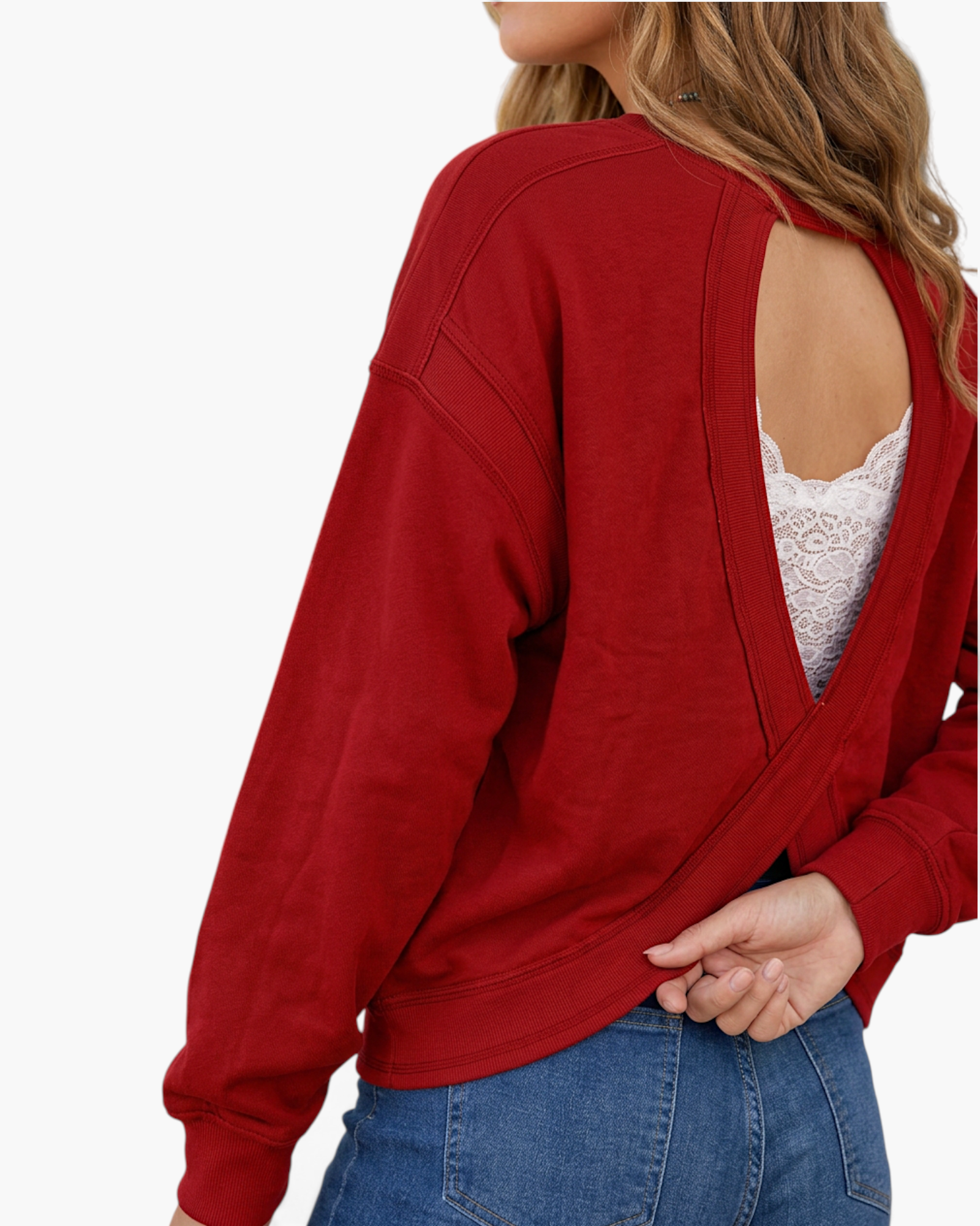 Beach Rose Co. deep red sweatshirt with an open-back twisted design worn over a white lace bralette
