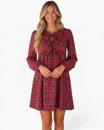 Beach Rose Co. red plaid mini dress with long puff sleeves, three front bow ties, and cutout details on a model.
