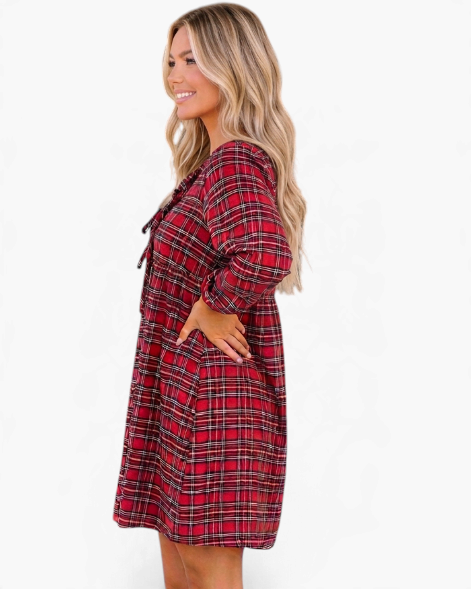 Beach Rose Co. red plaid mini dress with long puff sleeves and front bow ties worn by a blonde model, side view