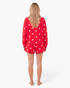 Beach Rose Co. red and white polka dot sweatshirt and skort set seen from the back on a model.