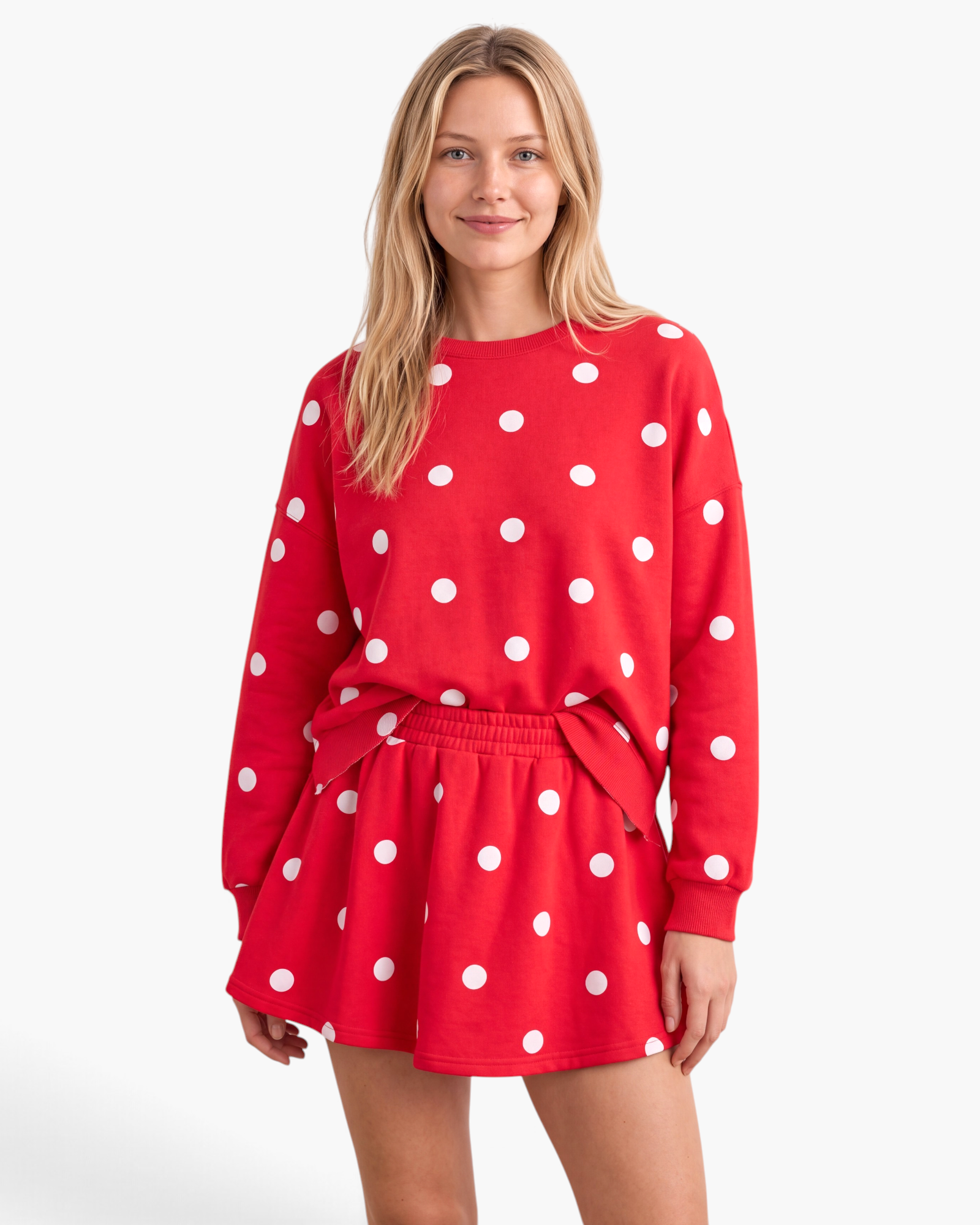 Beach Rose Co. red and white polka dot sweatshirt and skort set with dropped shoulders and a flared skirt overlay.