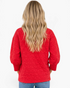Beach Rose Co. red quilted crewneck sweatshirt with geometric texture and ribbed cuffs, back view on a woman.