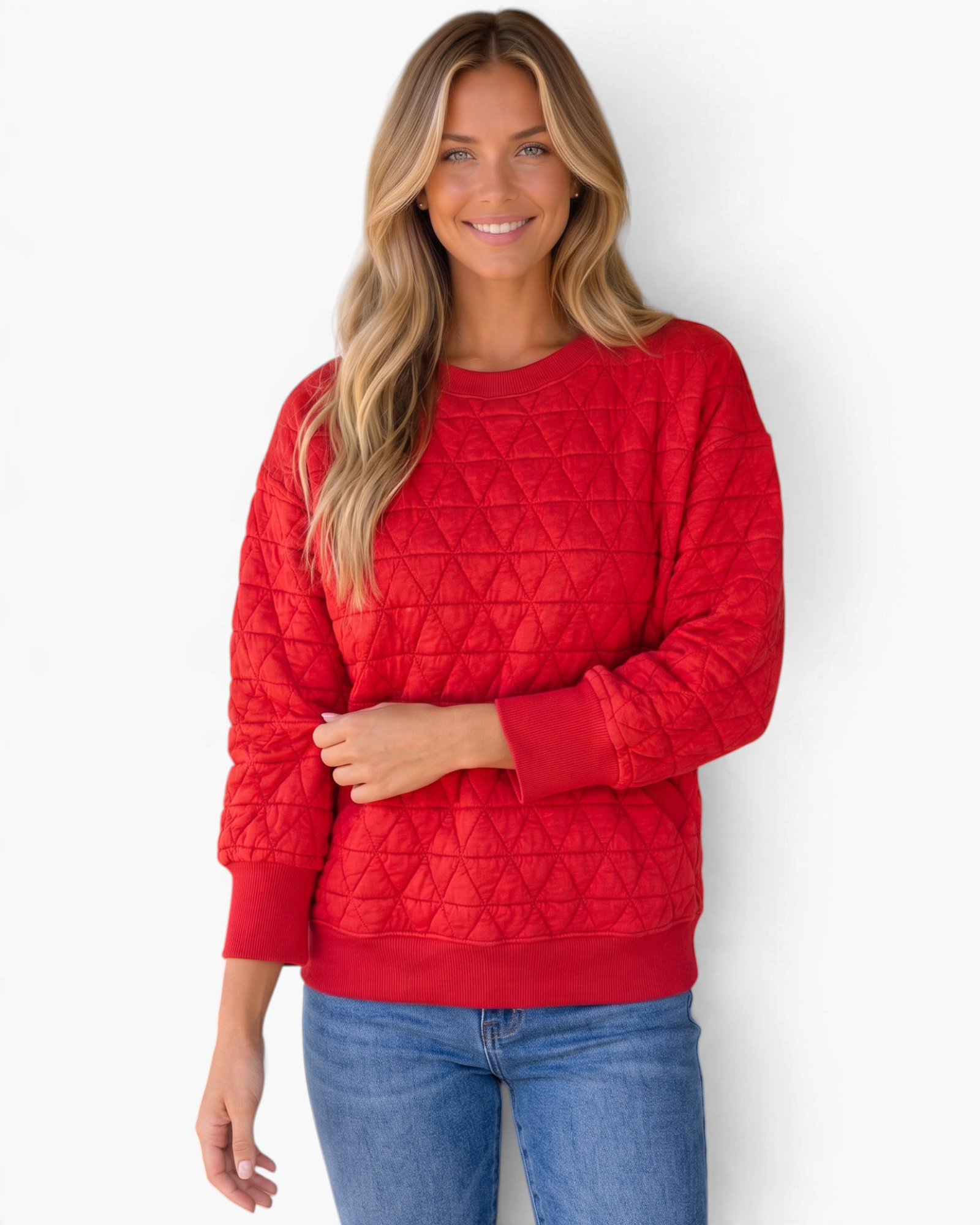 Beach Rose Co. red crewneck sweatshirt with geometric quilting, ribbed trim, and pockets worn by a smiling woman.