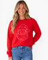 Beach Rose Co. red crewneck sweatshirt featuring a sparkling rhinestone Santa face design worn by a smiling woman.
