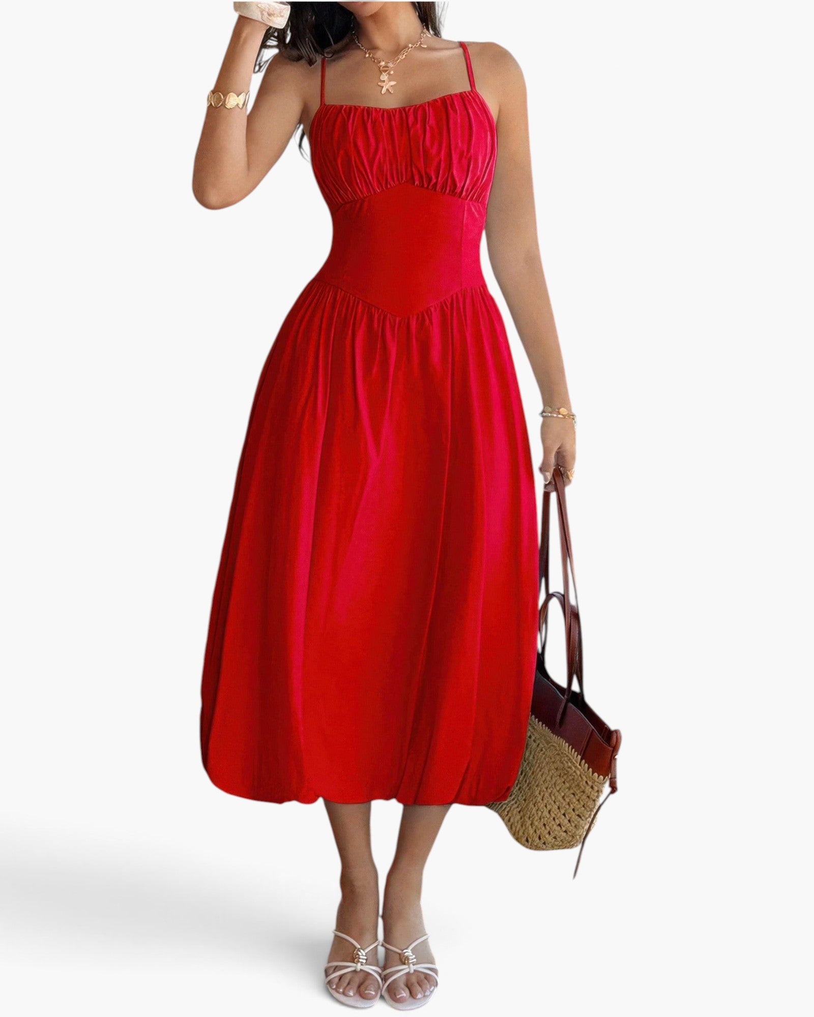 Beach Rose Co. red sleeveless A-line dress with a ruched bust, worn by a model with a straw handbag and sandals.