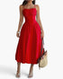 Beach Rose Co. red sleeveless midi dress with a ruched bust and A-line skirt, styled with a straw tote bag.
