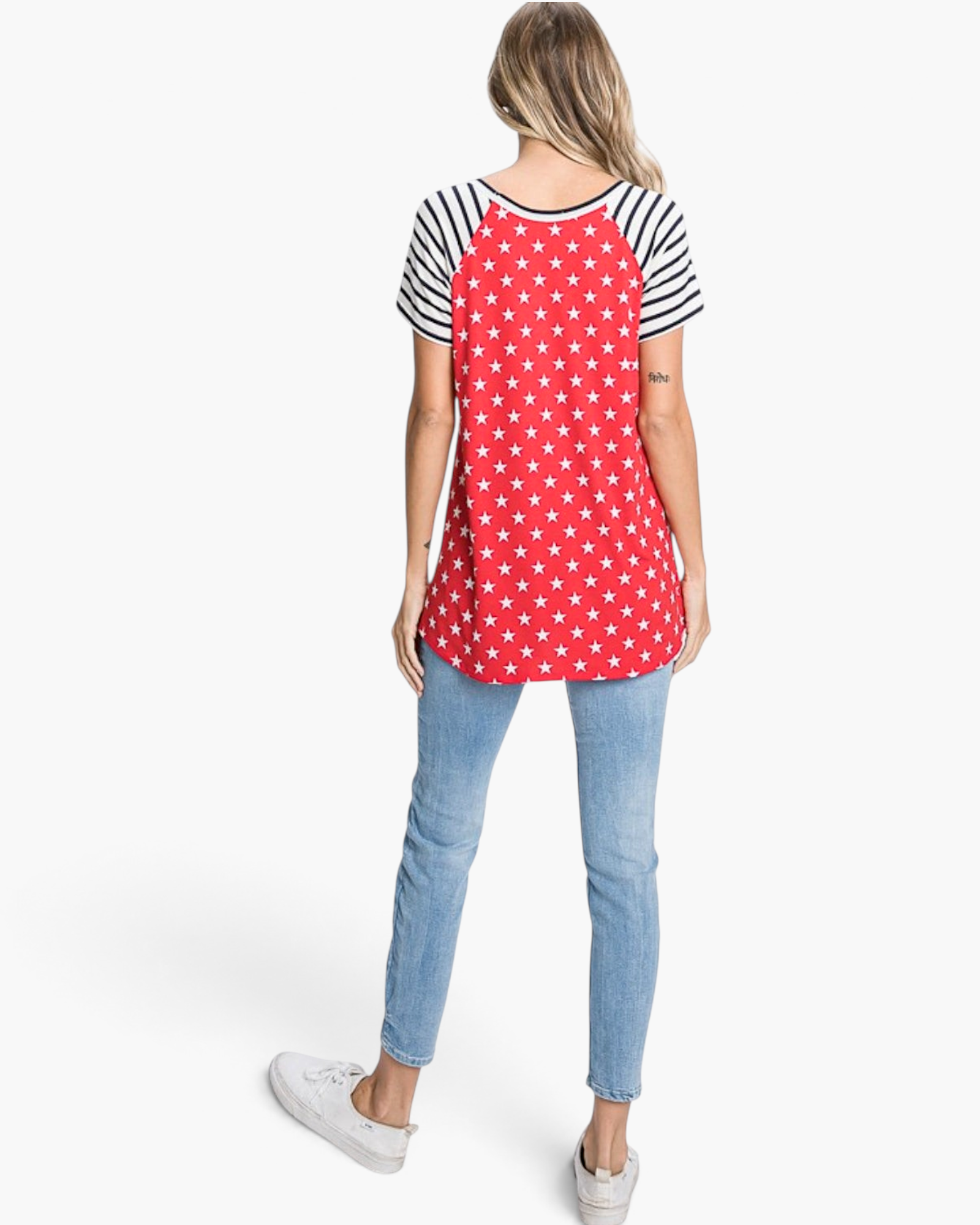 Beach Rose Co. red top with white star print and black-and-white striped raglan sleeves, back view on a model.
