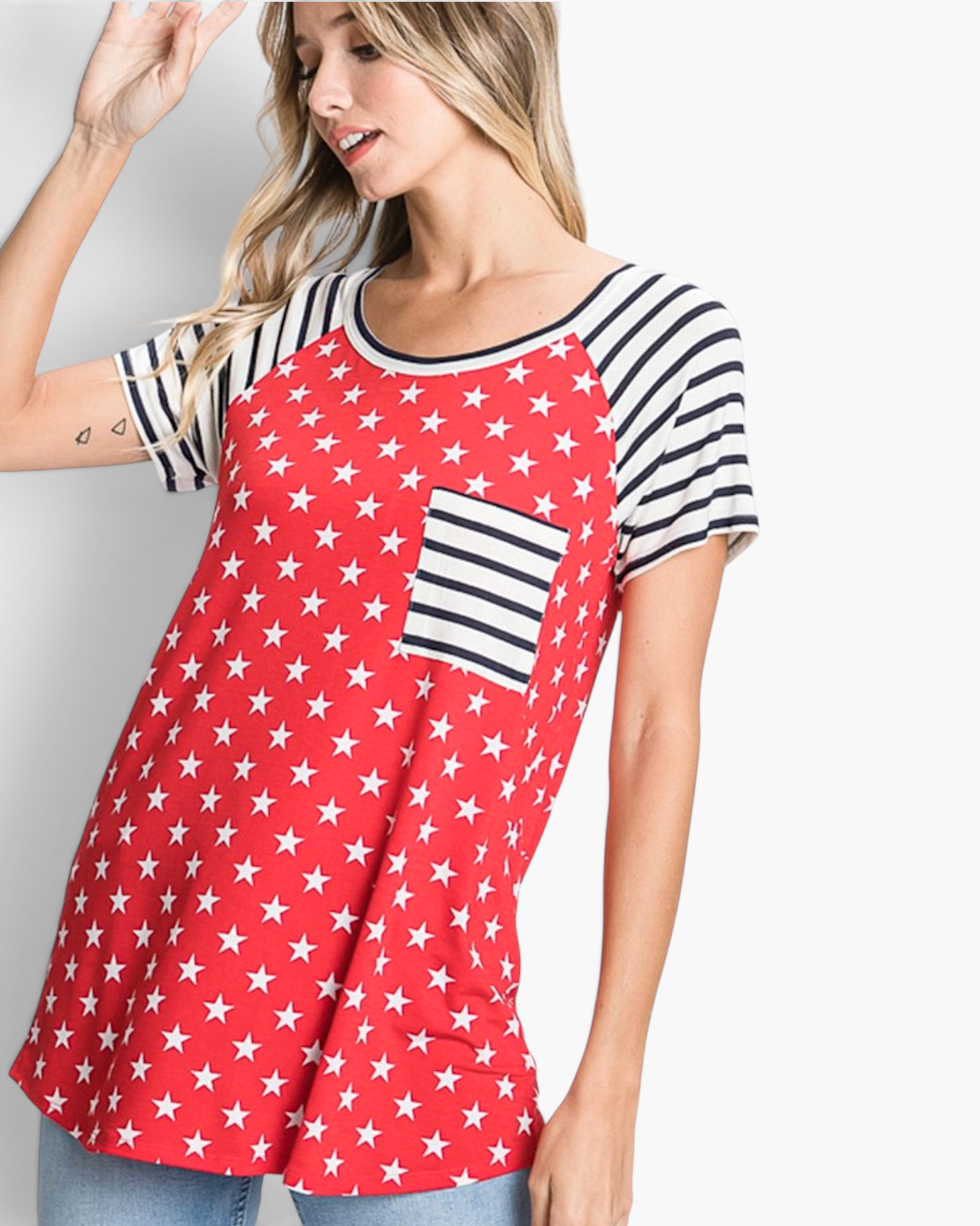 Beach Rose Co. red top with white star print, black-and-white striped raglan sleeves, and a matching chest pocket.
