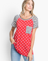 Beach Rose Co. red top with white star print, black and white striped raglan sleeves, and a matching chest pocket.