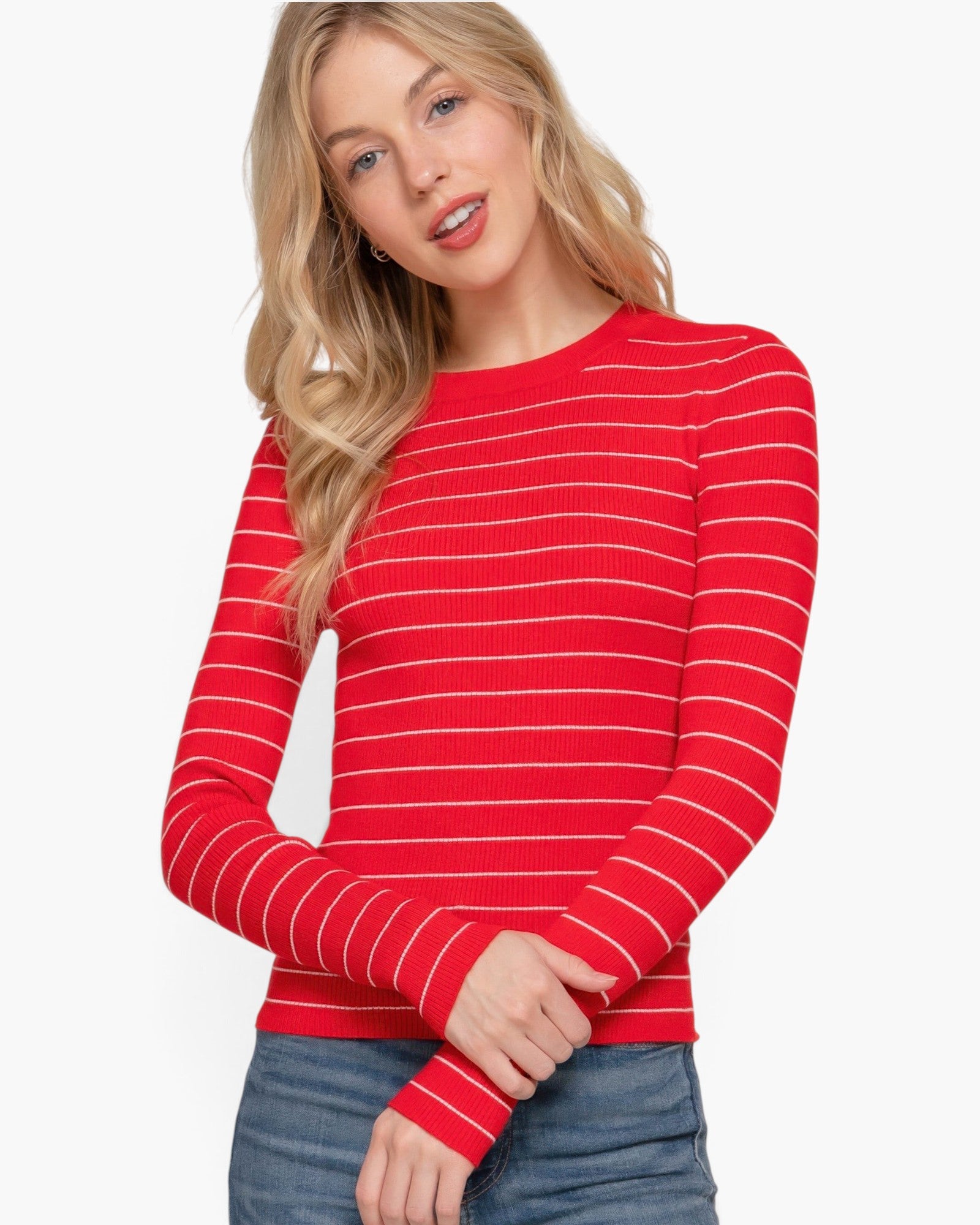 Beach Rose Co. model wearing a red and white striped long sleeve crew neck sweater with a ribbed texture.