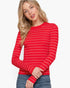 Beach Rose Co. model wearing a red and white striped long sleeve crew neck sweater with a ribbed texture.