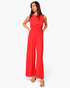 Beach Rose Co. red textured wide-leg jumpsuit with a twist-front waist detail worn by a model