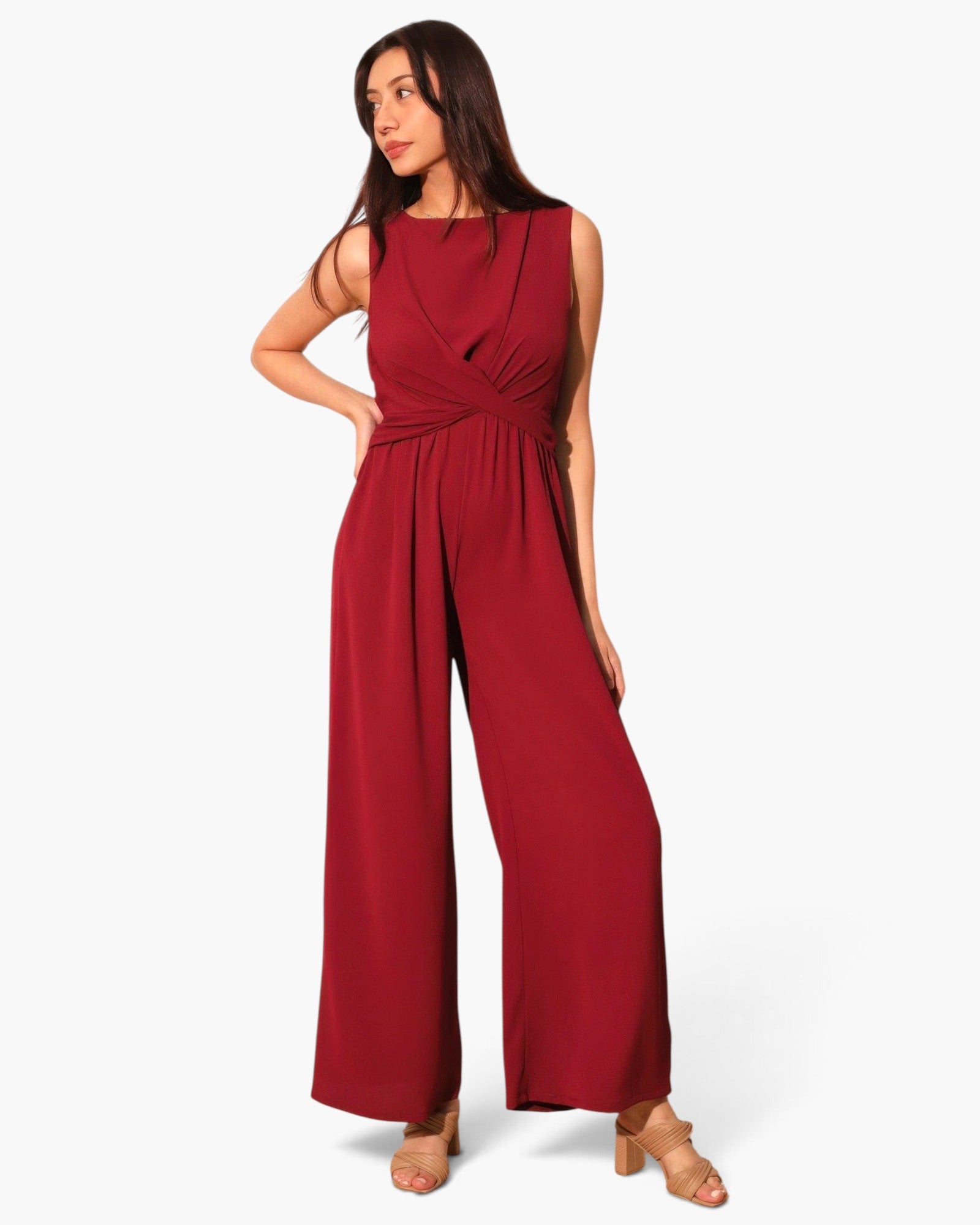 Model wearing a Beach Rose Co. red textured wide-leg jumpsuit with a flattering twist-front waist detail.